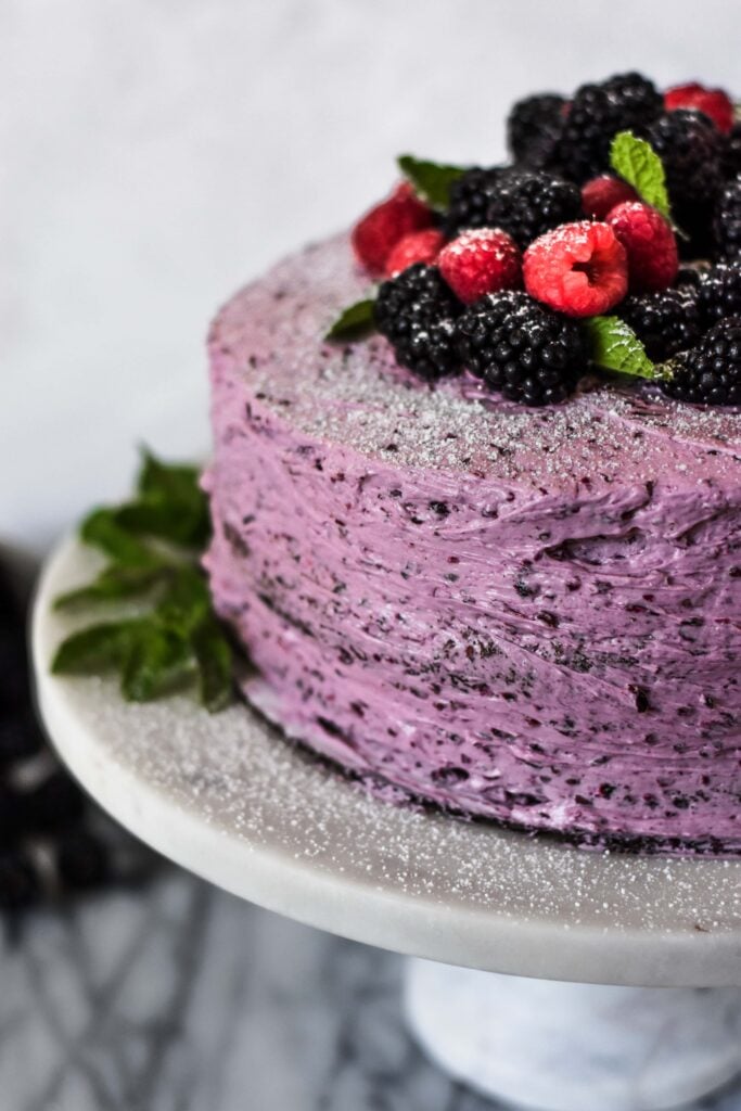 bourbon chocolate cake with blackberry buttercream close up of frosting