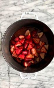 Strawberries in a pot ready to be cooked.