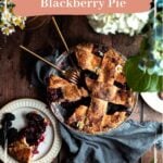 Blackberry Pie with a slice cut out and a fork and knife in the open space.