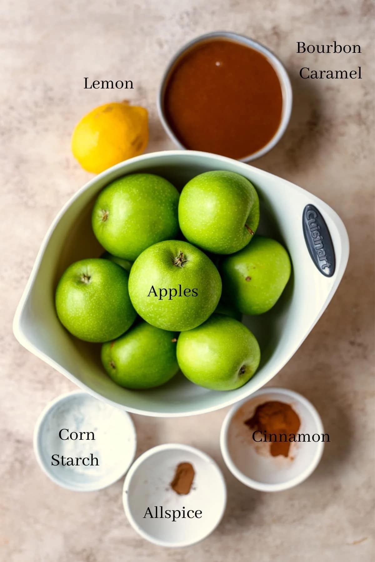 Ingredients for the apple pie filling on a brown table.