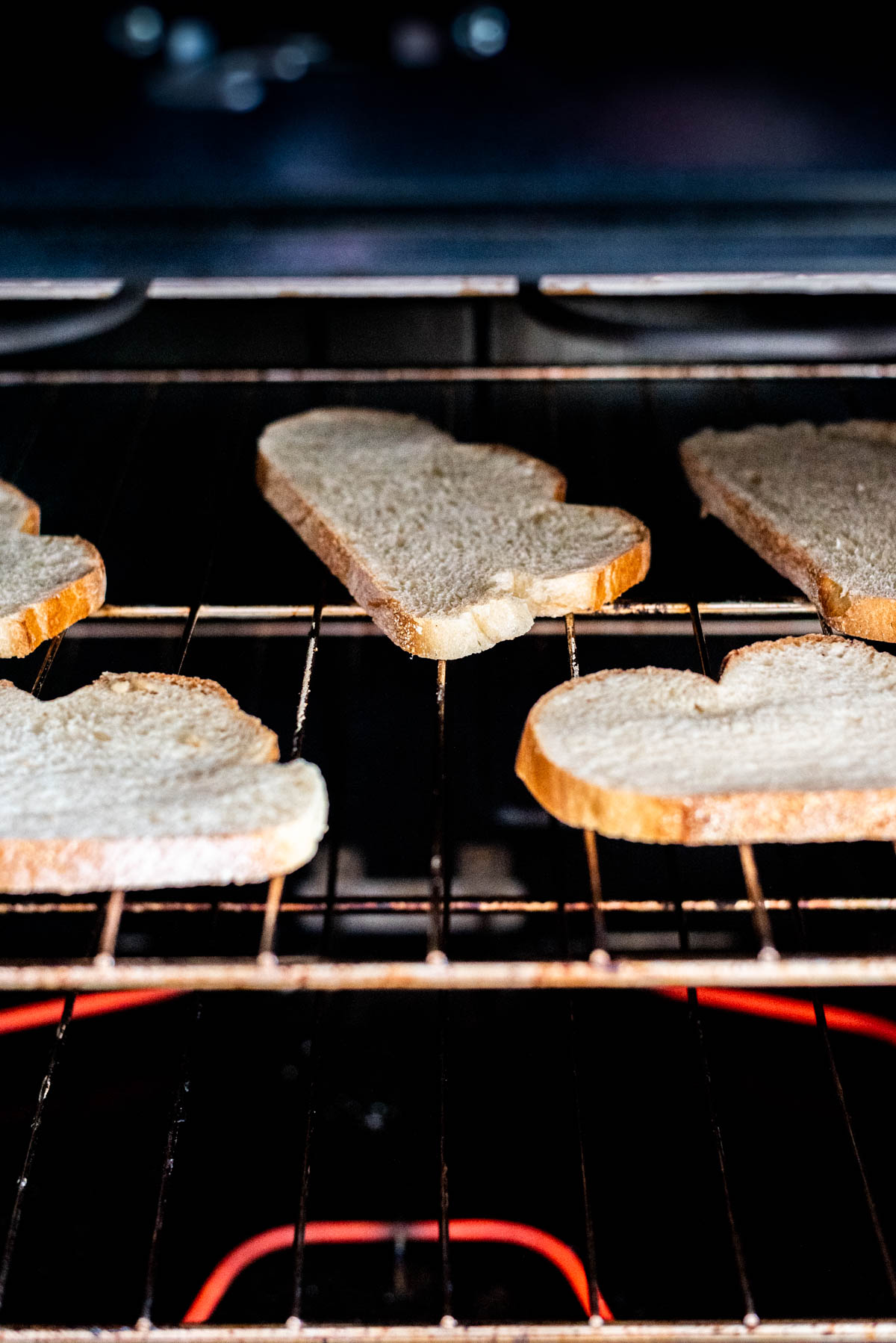 slices of bread being baked in an oven.