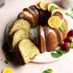 Lemon pound bunt cake with three slices cut and laying with in the ring of the bunt.