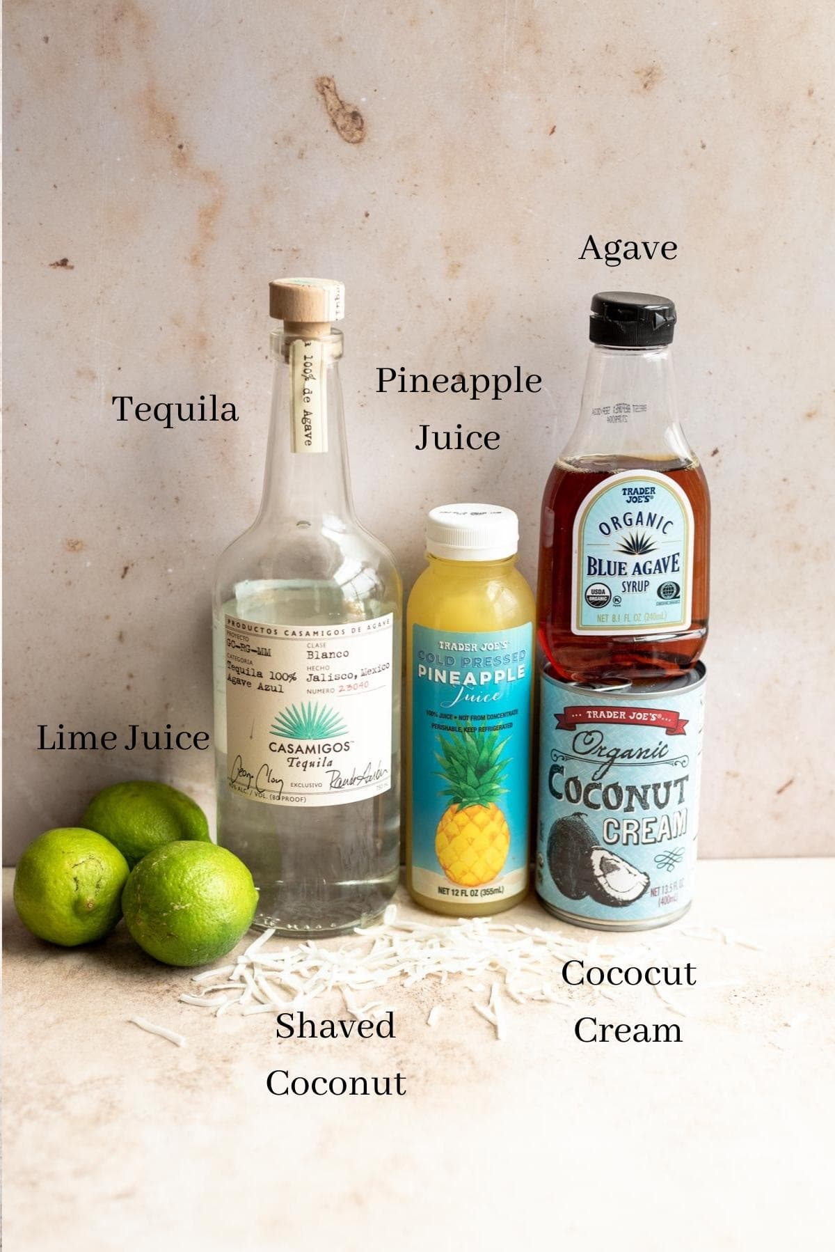 Ingredients for the margarita lined up against a wall.