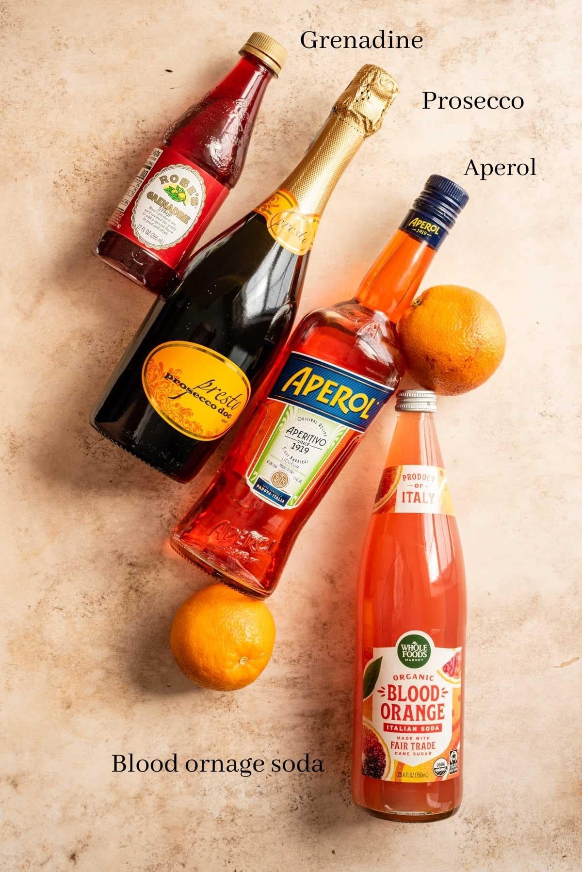 Ingredients for the spritz on a brown table.