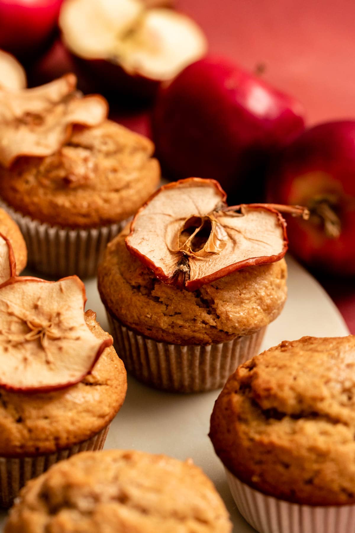Apple butter muffin with a dried apple sitting on top of the muffin.