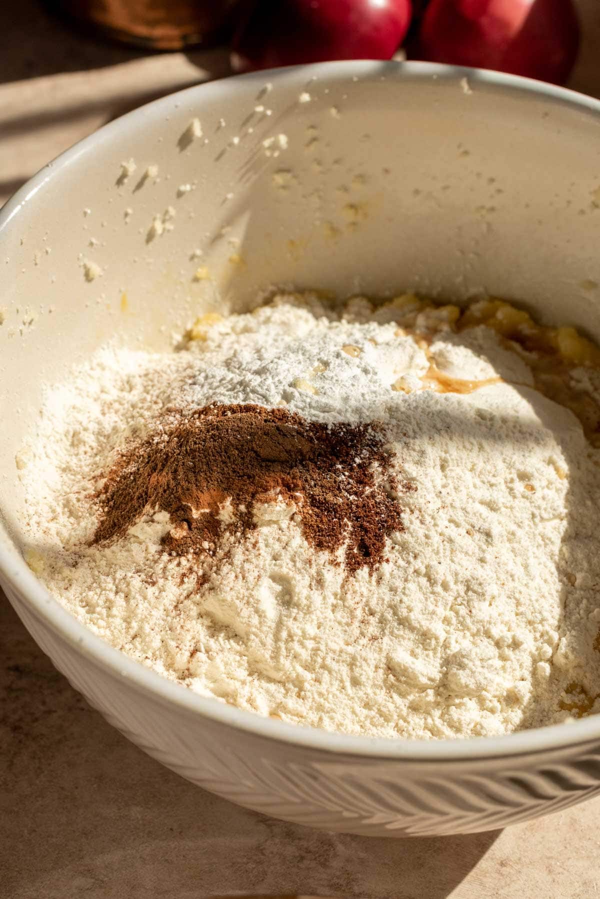 Flour and spices sitting on top of the batter.