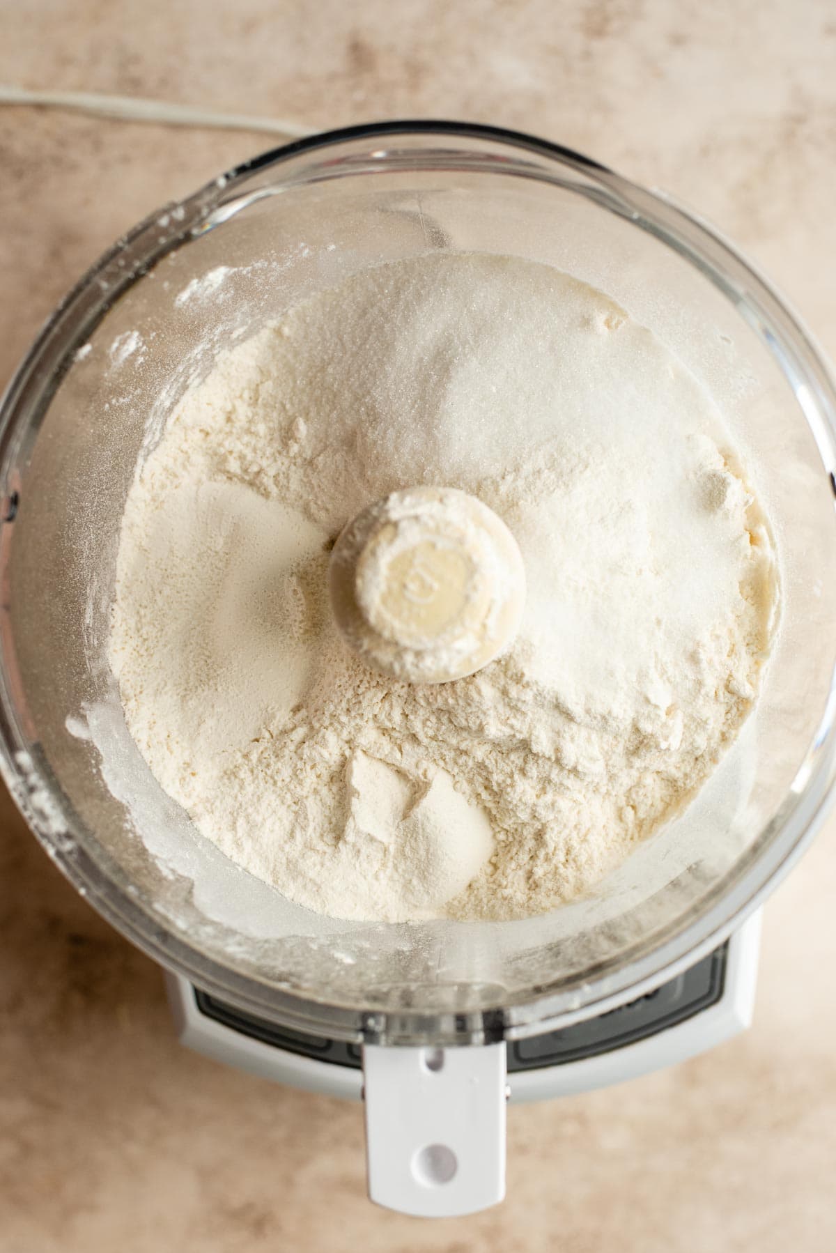 Flour and sugar in a food processor.