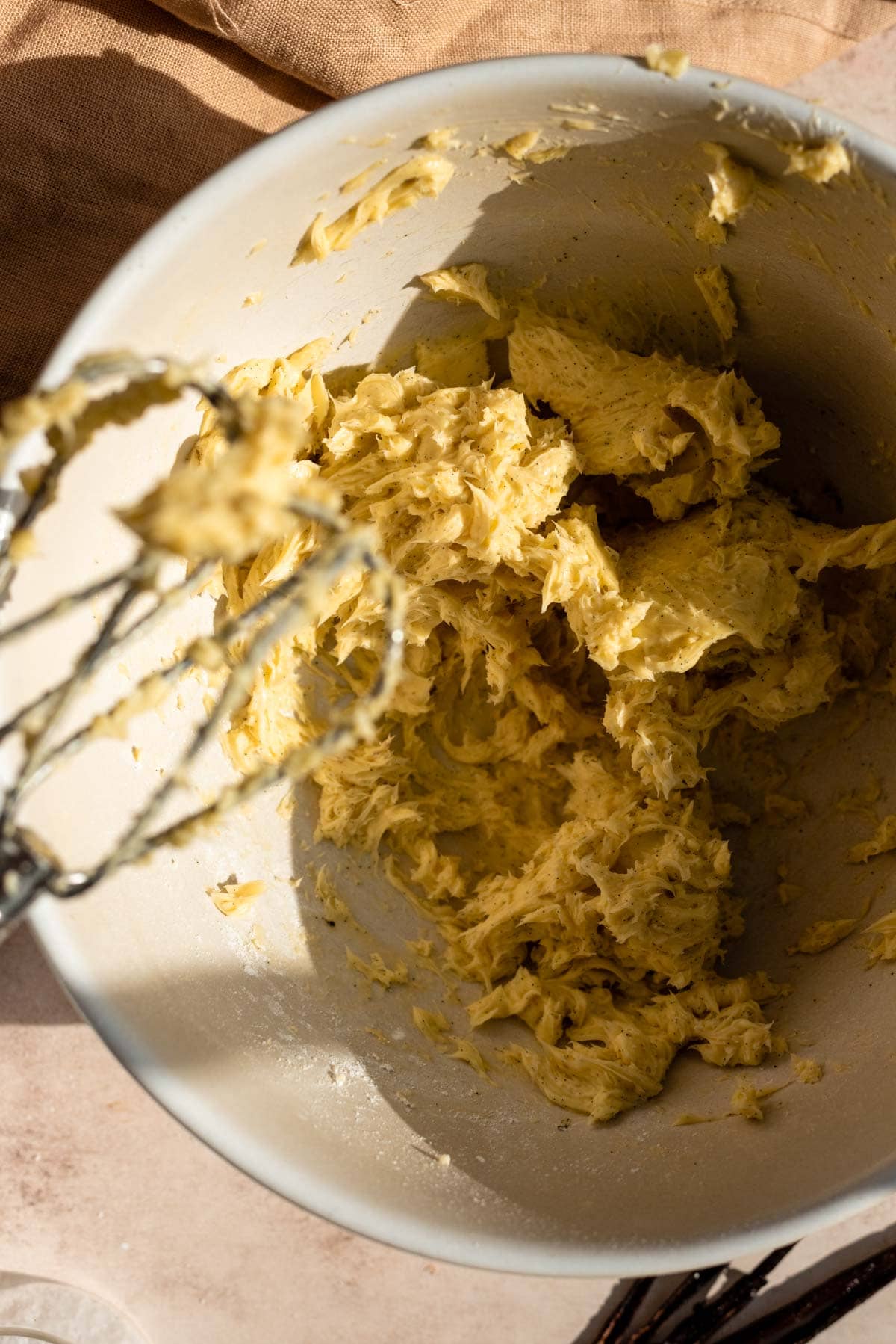 The butter mixed and whipped from an electric mixer.