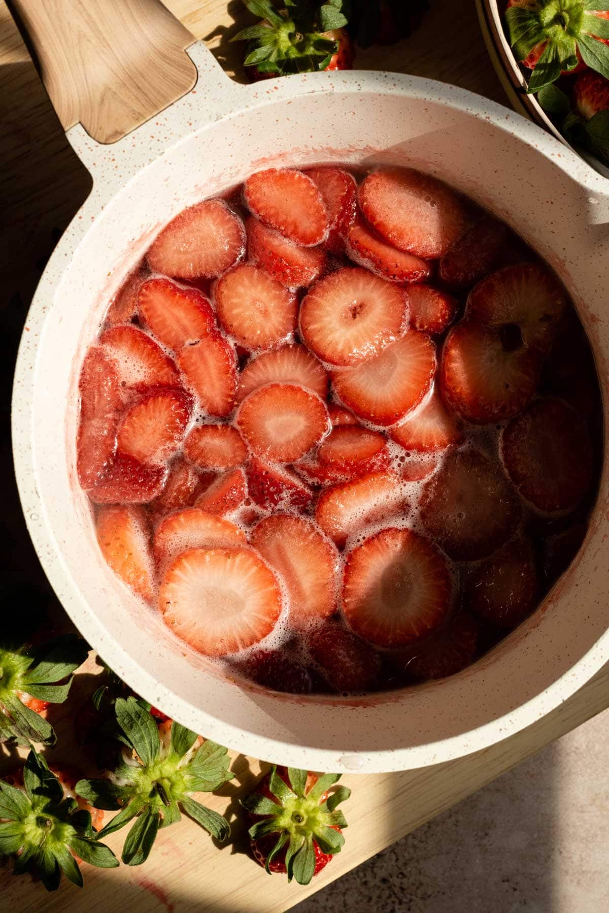 Cook the strawberries until they are pale.