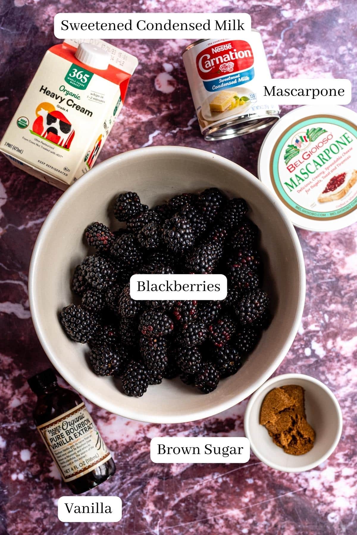 The ingredients for the ice cream on a dark purple marble background.