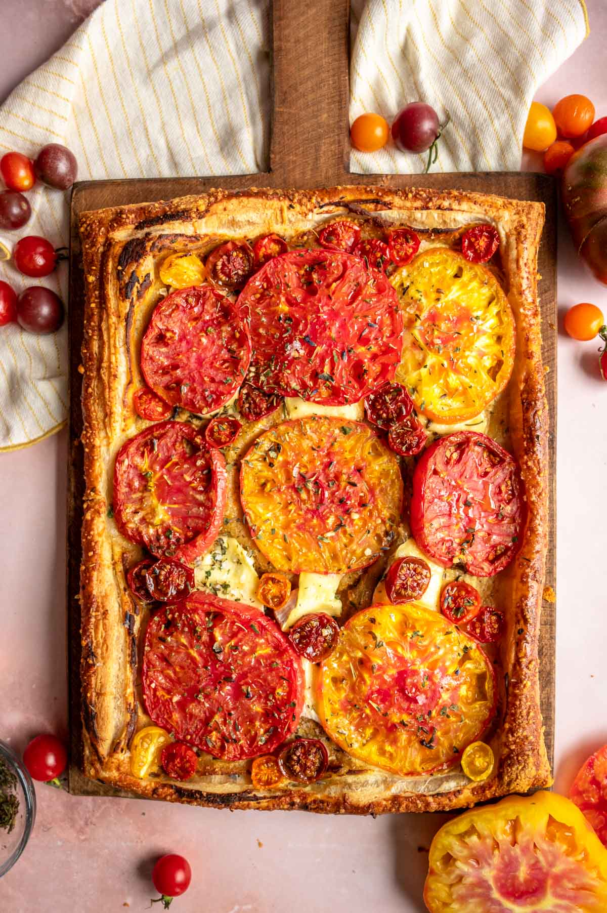The baked tart on a wood cutting board.