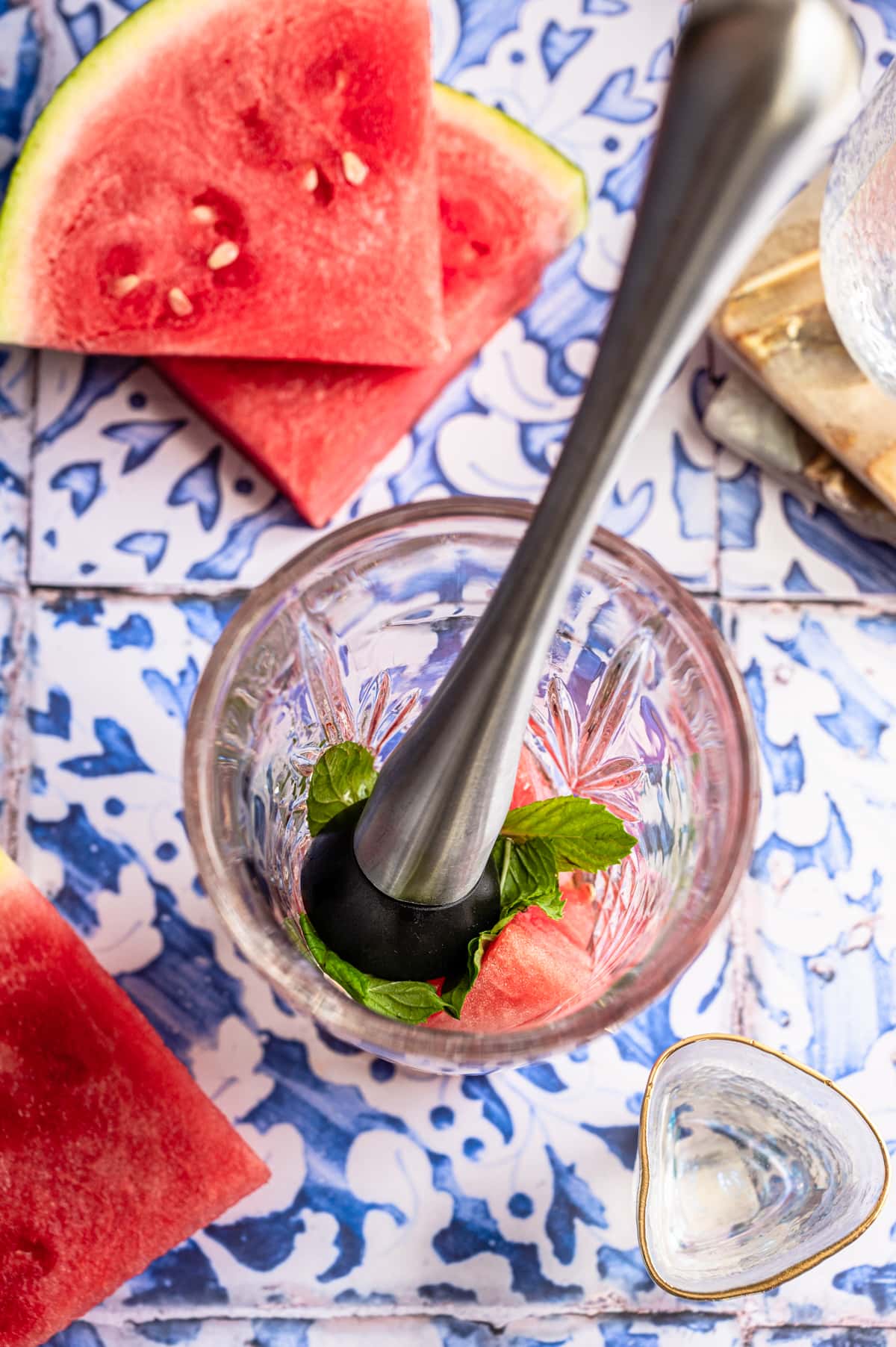 The watermelon, mint, and agave in a cocktail shaker.
