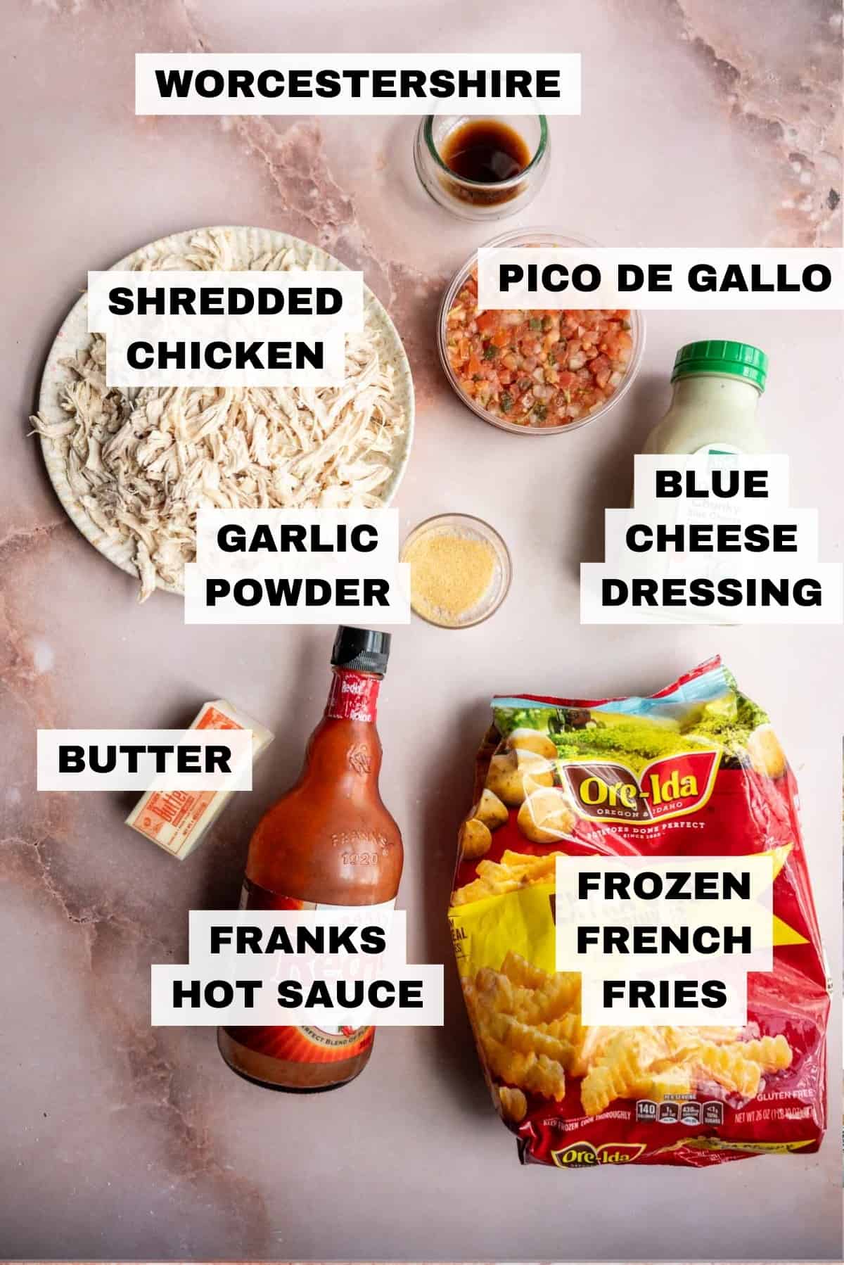 The ingredients for the buffalo chicken fries on a pick marble table.