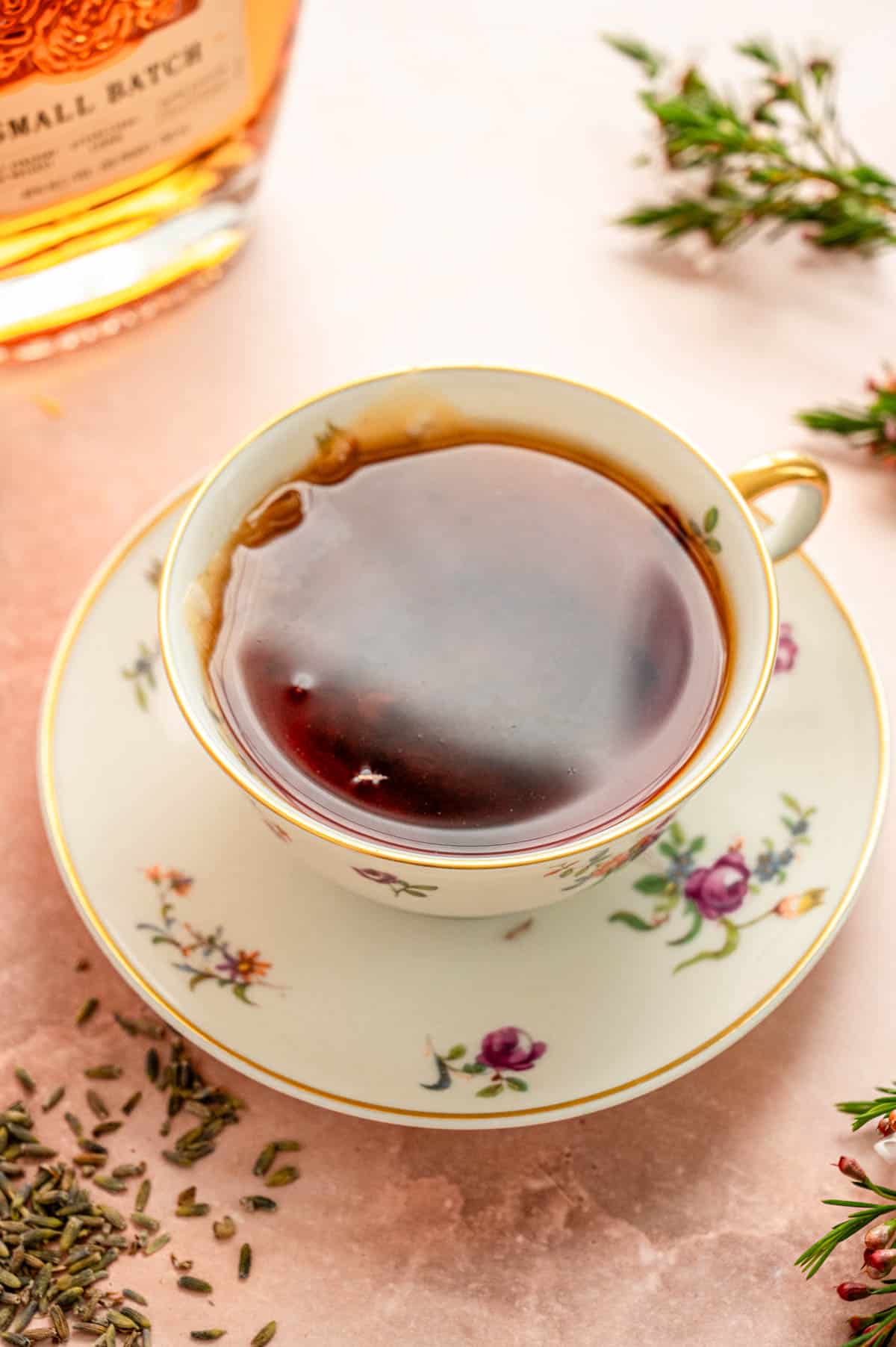 A china tea cup and saucer with filled with brewed tea.
