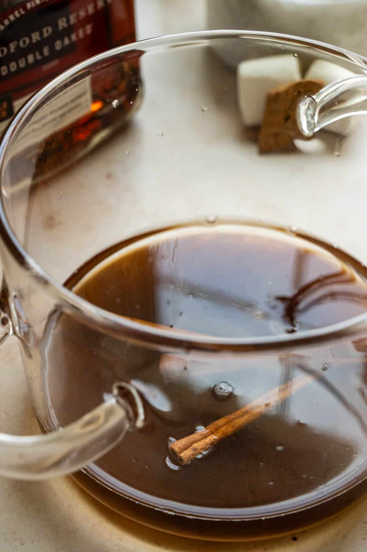 The syrup in a glass sauce pan.