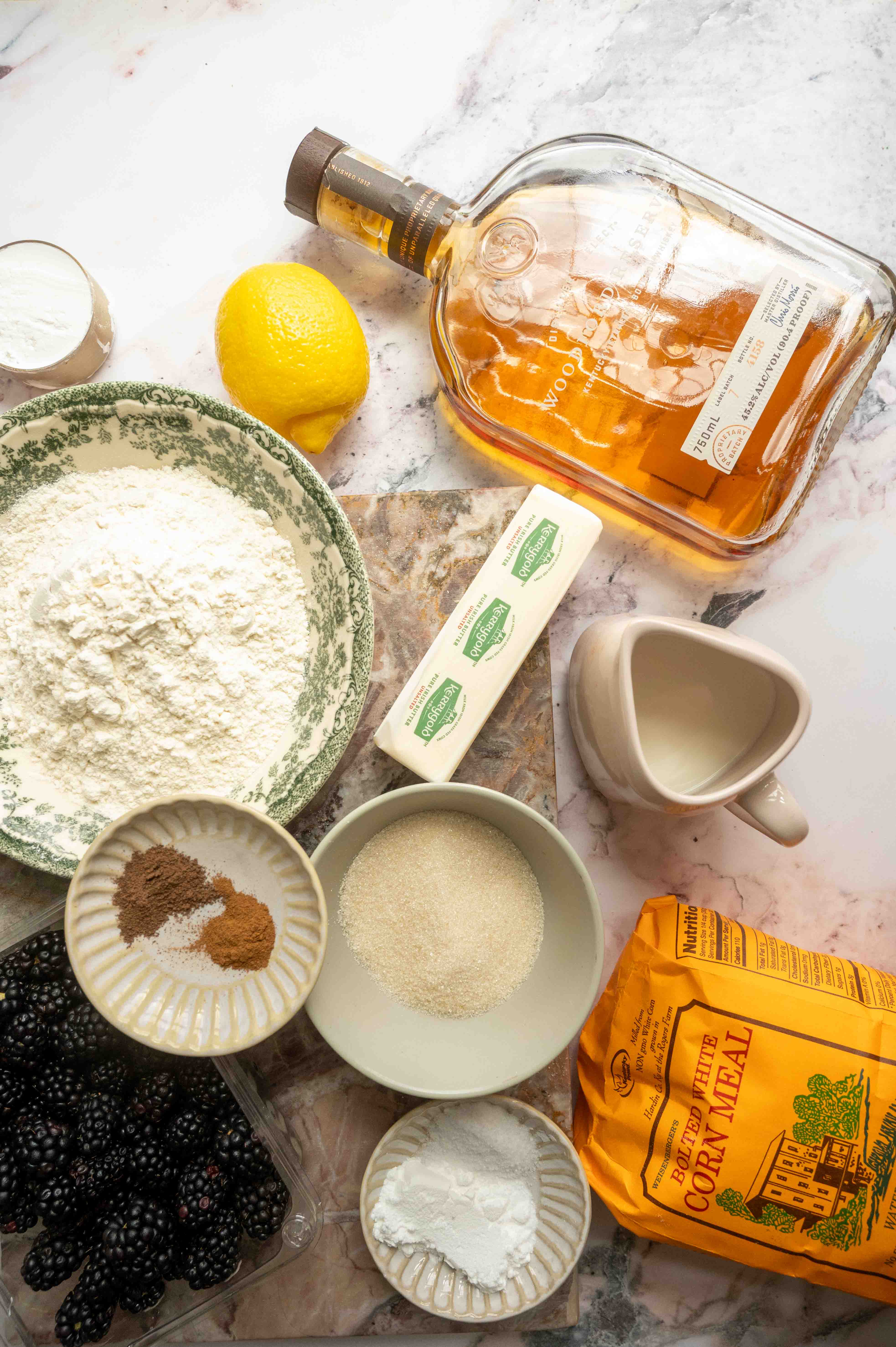 The ingredients for the cobbler on a white marble table.