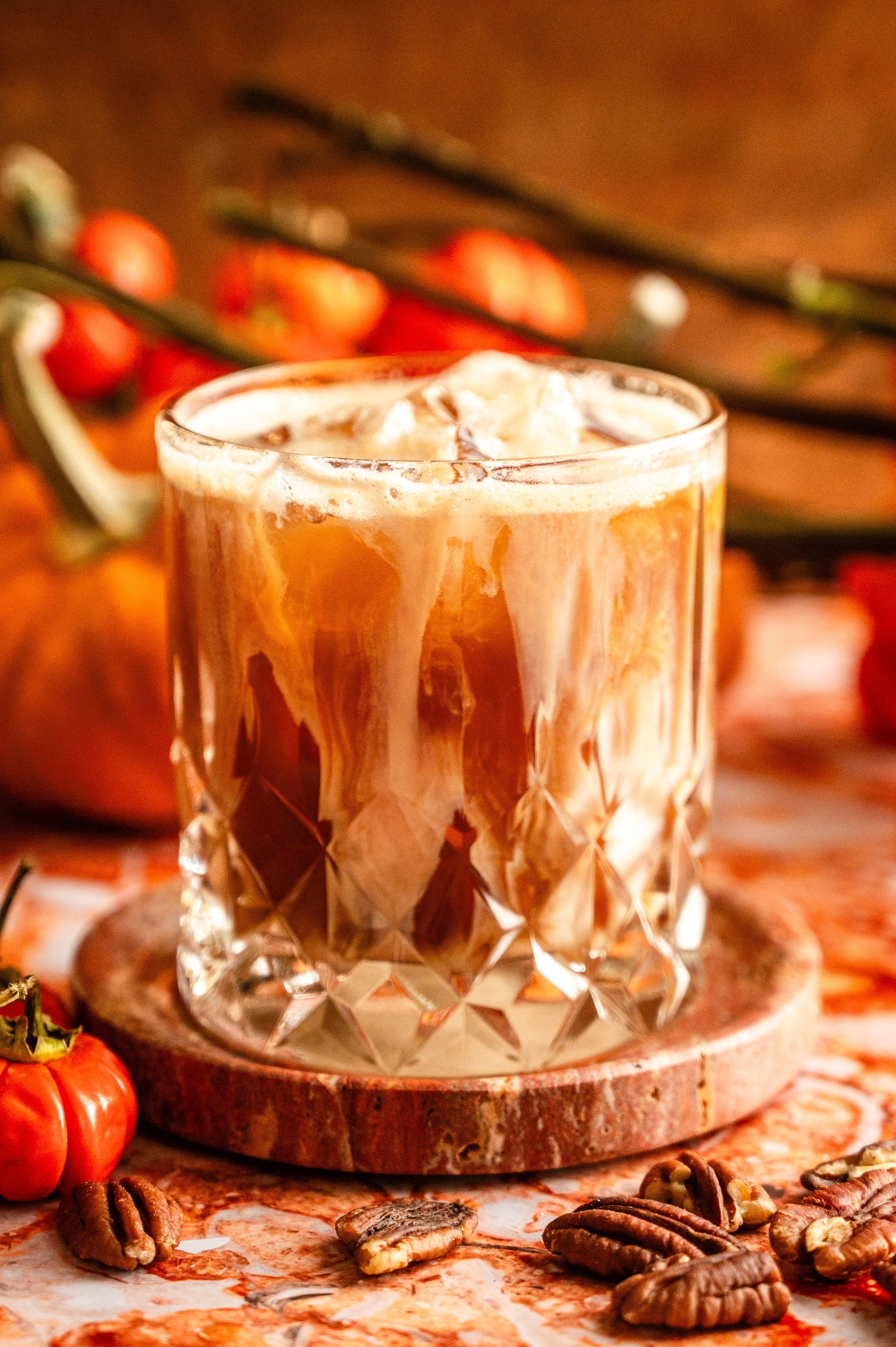 The cocktail has been pored into a rocks glass and topped with baileys.