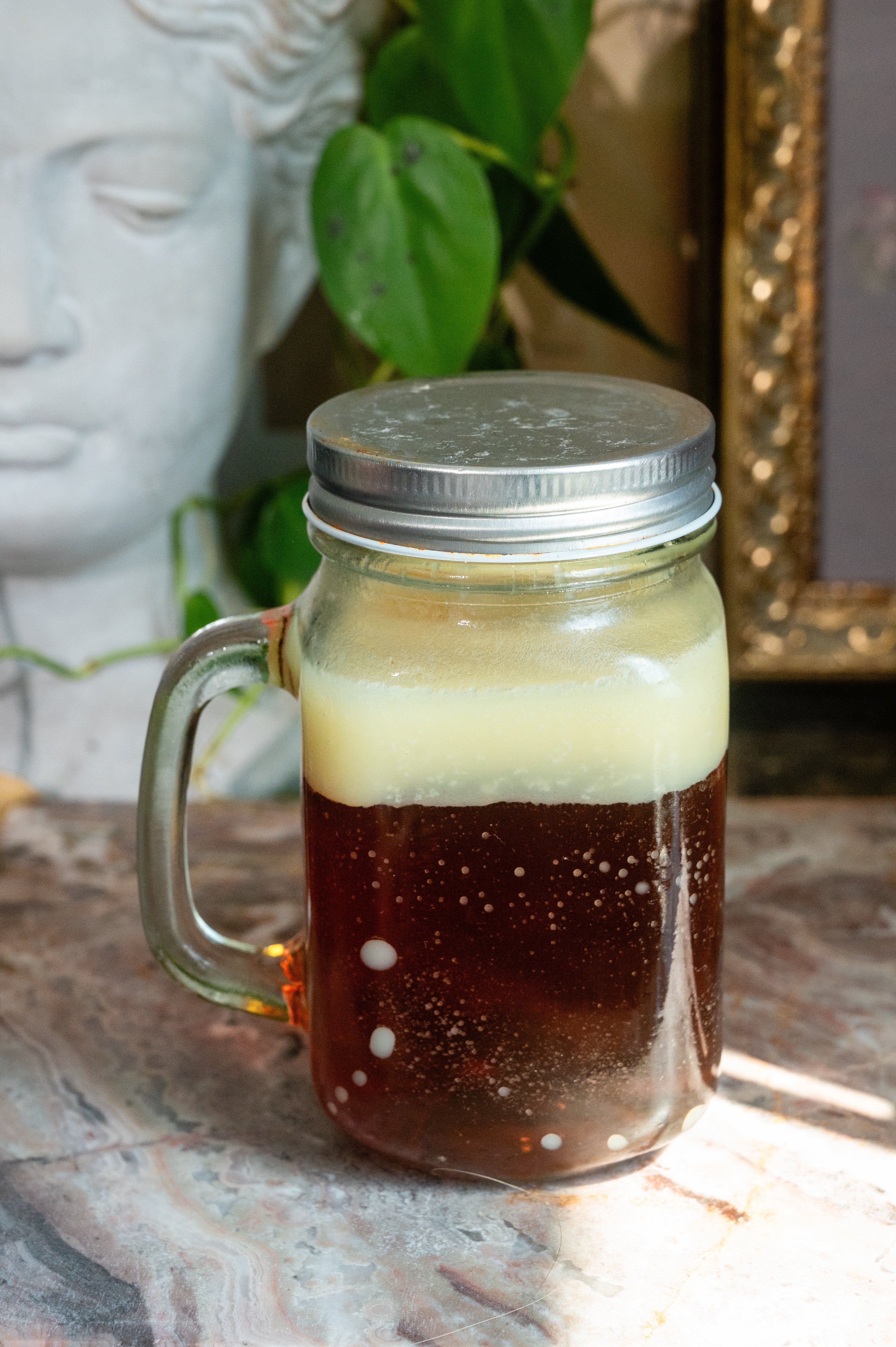 Truffle fat washed bourbon in a mason jar.