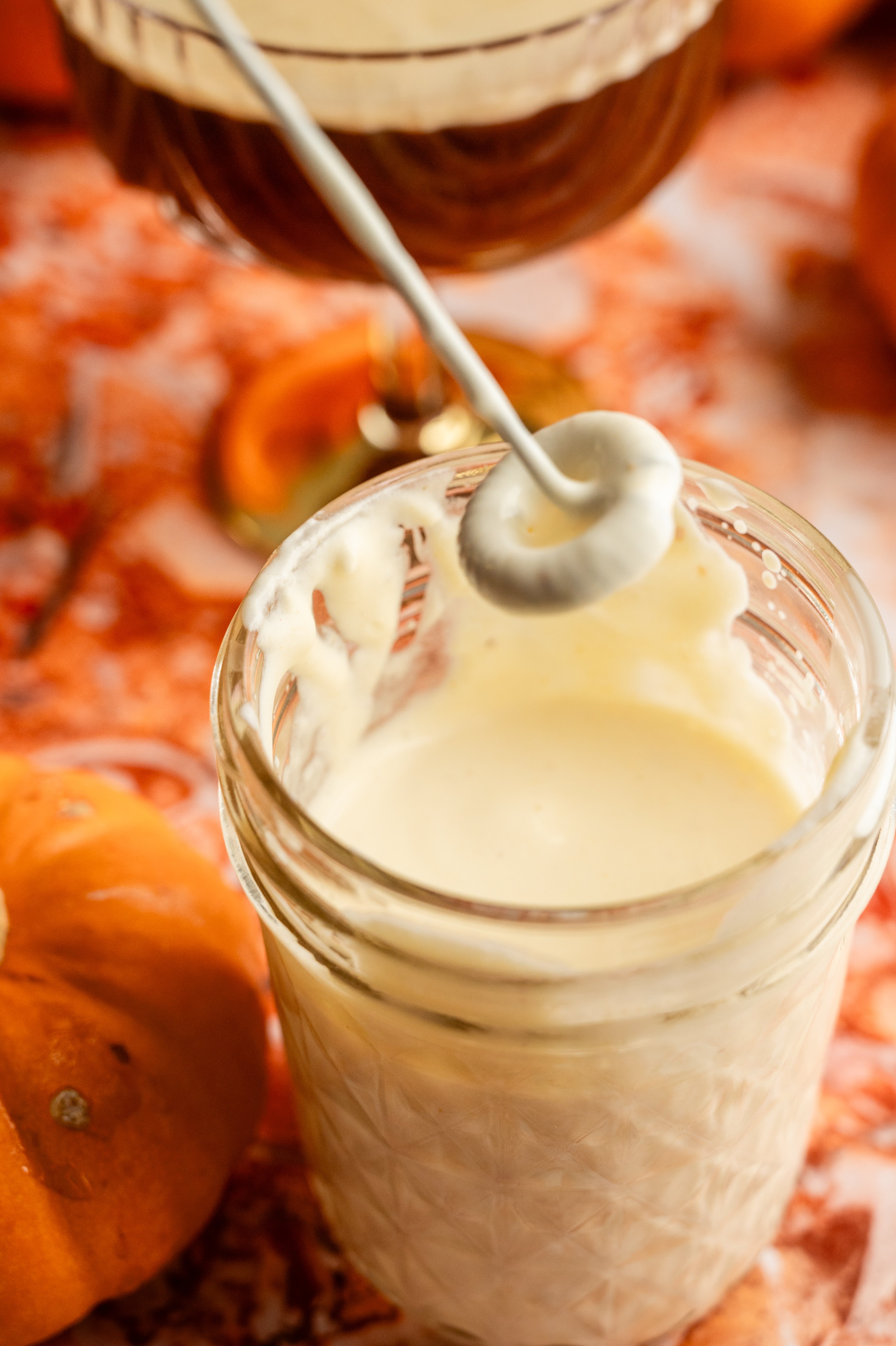 The heavy cream, pumpkin butter, and marscapone in a small glass jar. lightly whipped.