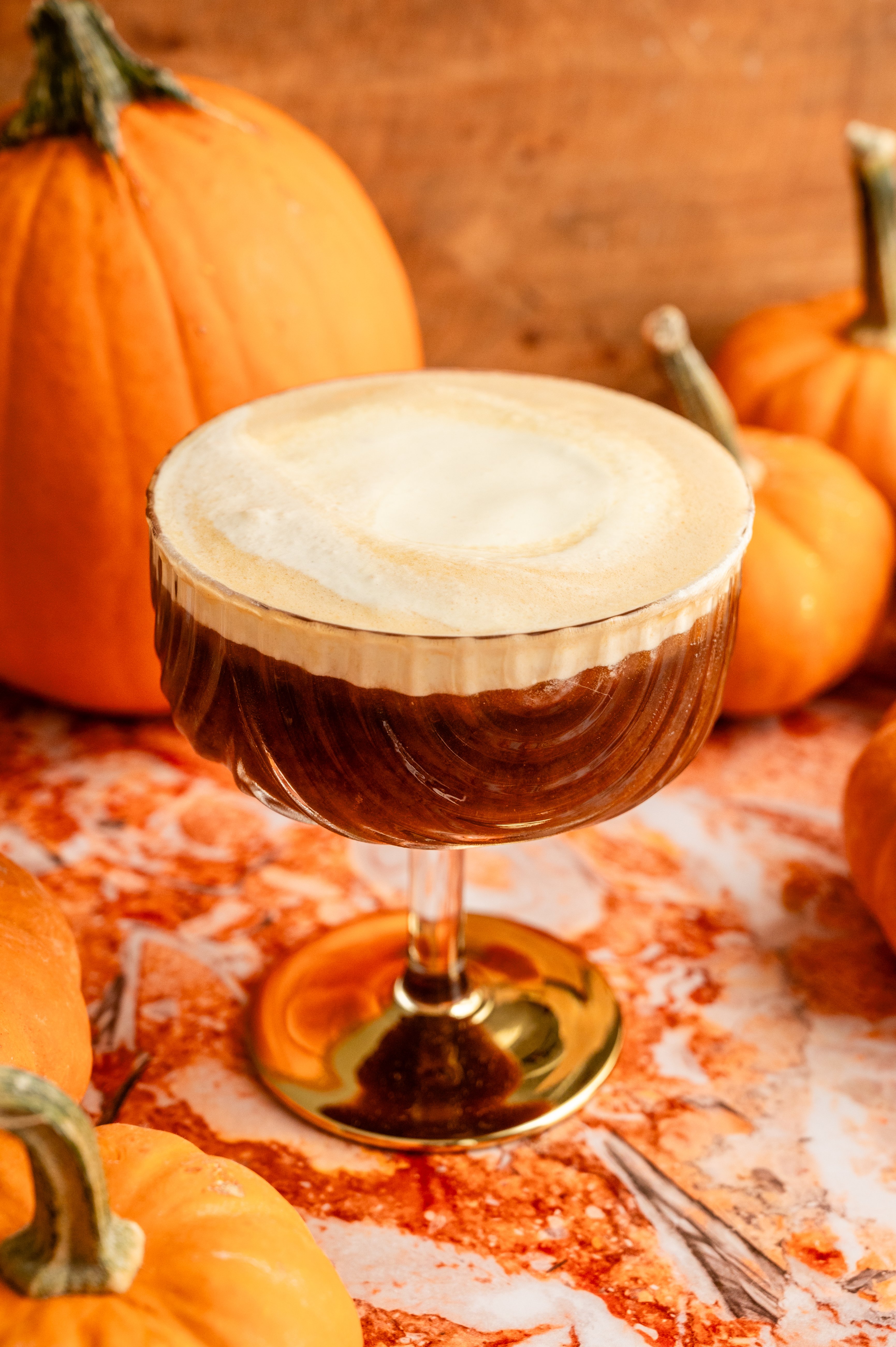 The whipped cream sitting on top of the cocktail.