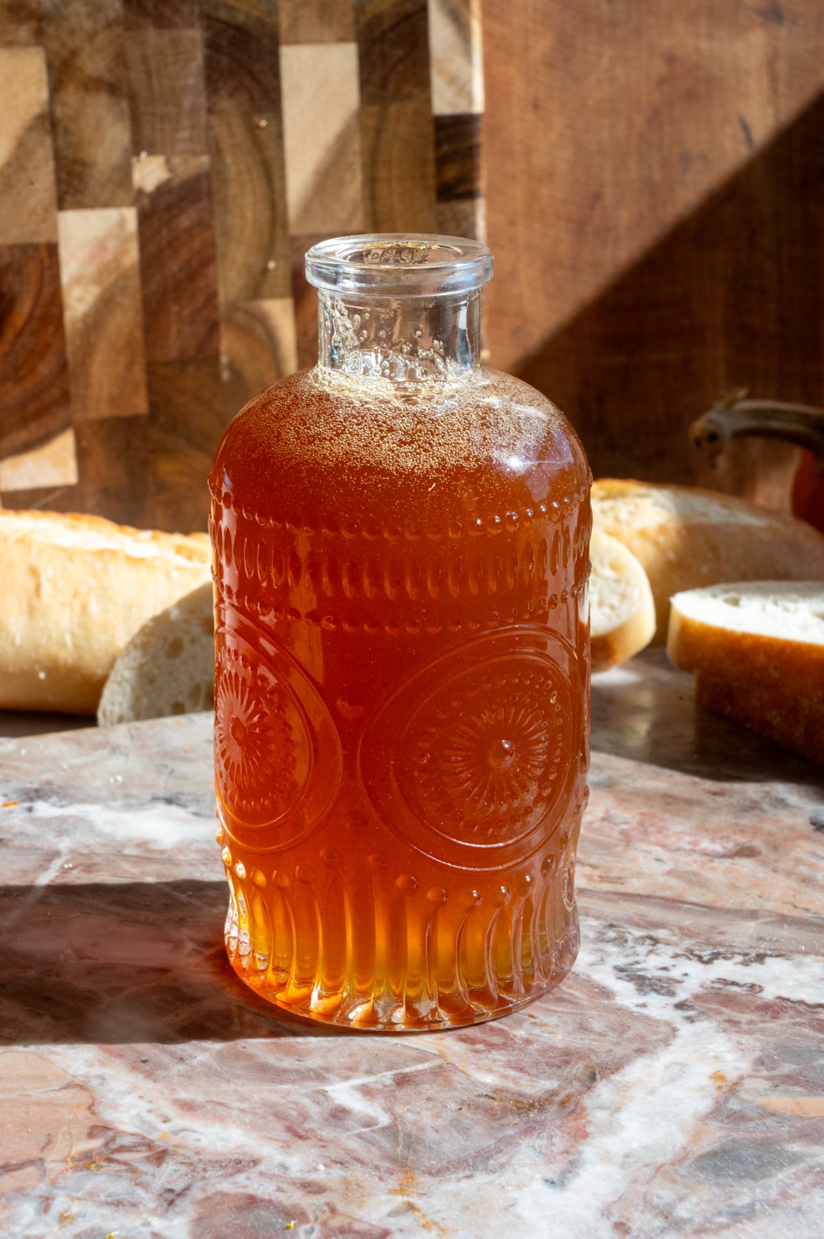 Honey syrup sitting in a small glass container.